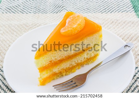 Oranges cake slice,fruit cake on white background.