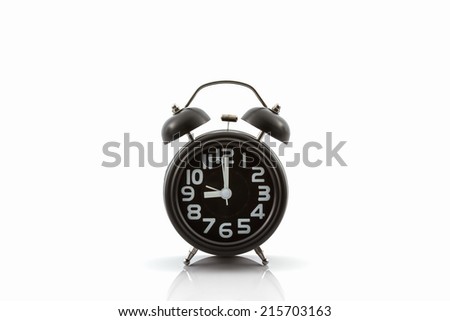 Black old fashion alarm clock on white background.