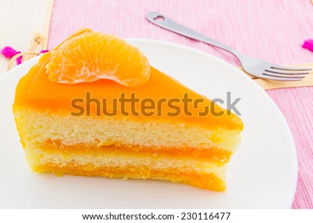 Oranges cake slice,fruit cake on plates.