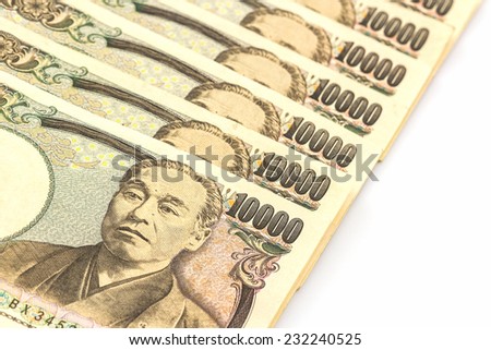Japanese Yen banknotes on white background.