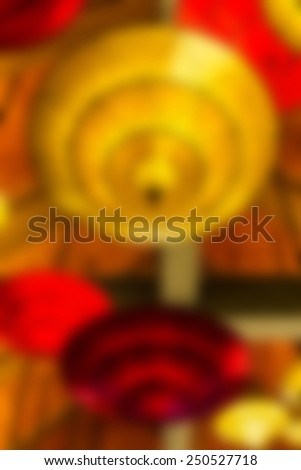 Abstract light blurred background, beautiful hanging lamps on the ceiling.