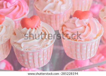 Colorful of sweet cup cake on plate, vintage color.