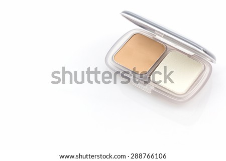 Makeup powder in white case on white background.