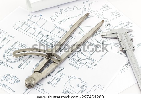 Engineering dividers Tools and Vernier scale on blueprint background, Construction concept..