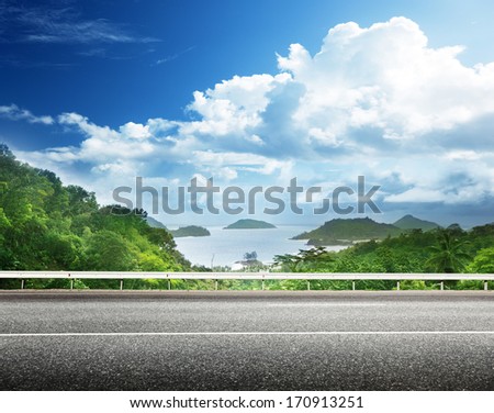 asphalt road and tropical forest