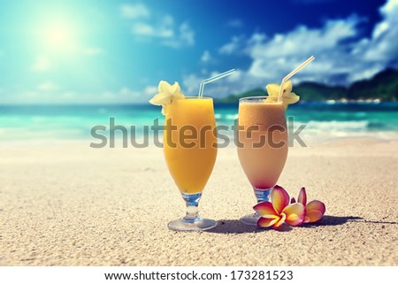 fresh fruit juices on a tropical beach