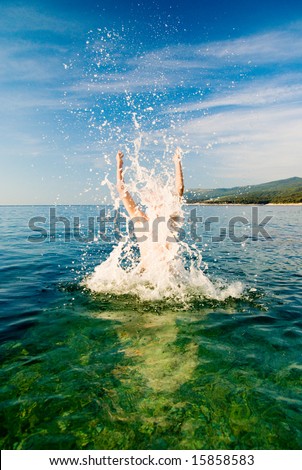 man are jumping from ocean water