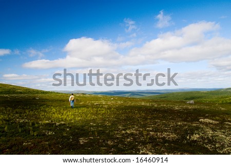 one traveler are walking in mountain tundra
