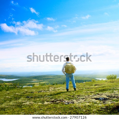 one traveler walking in north mountain tundra