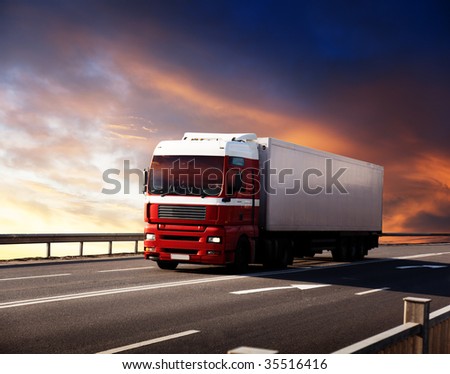 truck on highway and sunset