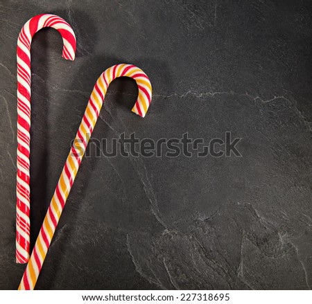 Two Candy Canes On Black Background. Copy Space