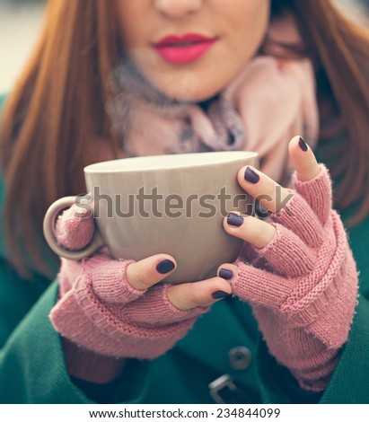Close Up Of Woman Hands Holding A Cup Of Hot Beverage