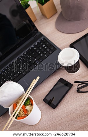 Lunch Box With Chinese Food And Work Equipment On Working Desk