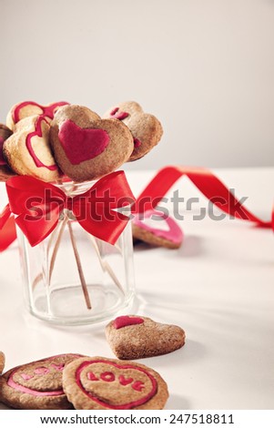 Homemade Heart Shape Cookies On Stick In A Glass.