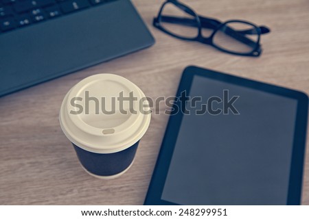 Cup Of Coffee And Work Equipment On Working Desk