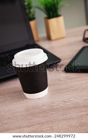 Cup Of Coffee And Work Equipment On Working Desk