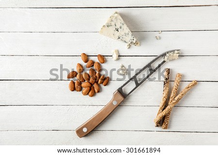 Preparing Tasty Snack With Blue Cheese And Almond