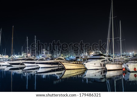 Moored yachts at night