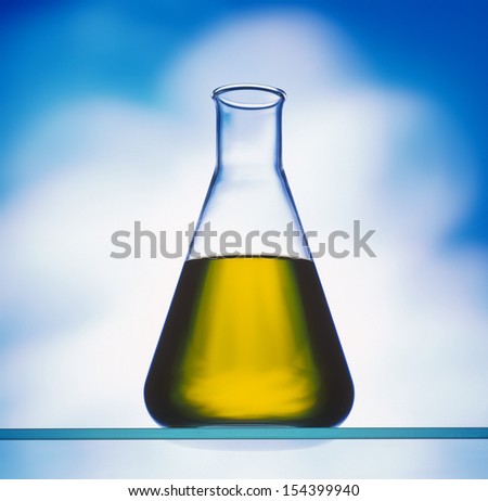 biodiesel in erlenmeyer flask on blue background