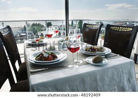table for four people at roof restaurant