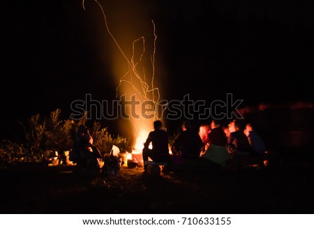 beautiful scenery of night view. bonfire around people,\
bask near the fire, the concept of recreation