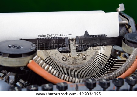 Concept image with Make Things Happen printed on an old typewriter