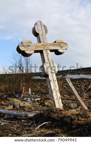 An anonymous wooden cross at the hill side.