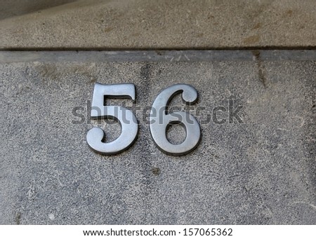 photos of house numbers, numbers of doors, fences rooms, rooms gables of houses in a small town near Barcelona, Spain.