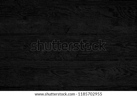 Vintage rustic black wood texture of old pine planks. Abstract black background with pattern.