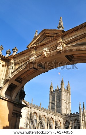 The spire of Bath Abbey framed by a Georgian archway