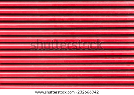 Red striped metal background texture close up