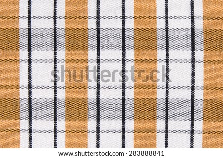 Striped black and yellow fabric background texture close up