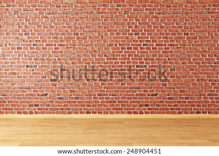 Empty room with brick wall and wooden floor