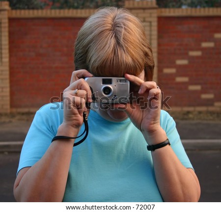 Female Photographer with point and shoot camera