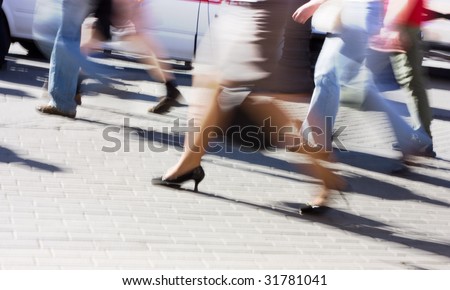 People are always running. Urban scene motion blurred.