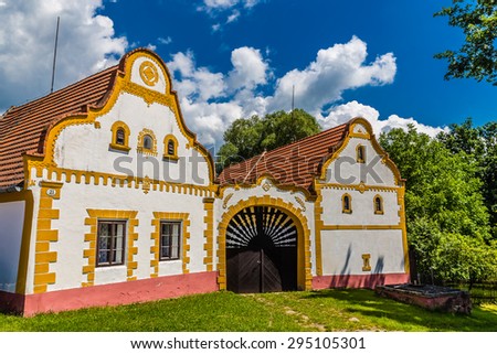 Typical Czech traditional farm house in Southern Bohemia with deep blue sky and trees-Czech Republic,Europe