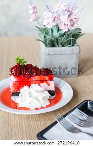 strawberry cheese cake on the table.