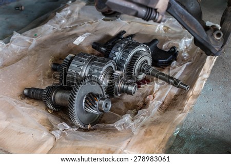 automobile engine steel gears and bearings disassembled for repair