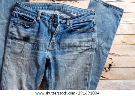 blue jeans on wood background