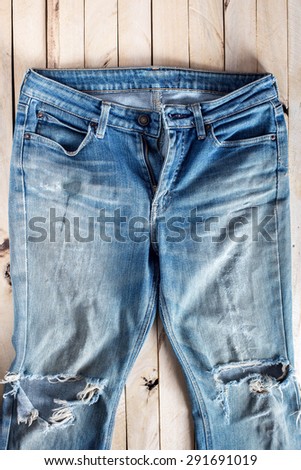 blue jeans on wood background