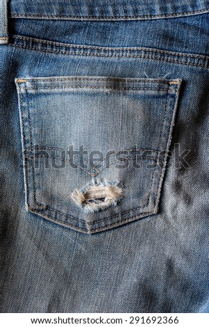 old blue jeans that is a bit torn