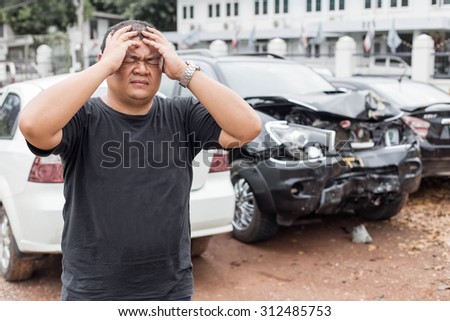 Asian people of desperate man after car crash