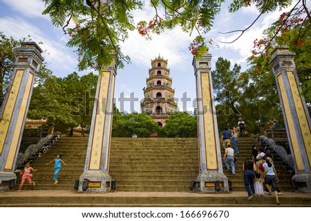 4 JUNE 2011 - HUE, VIETNAM - People walk up the stairs to the Thien Mu Pagoda, on 4 June 2011, in Hue, Vietnam