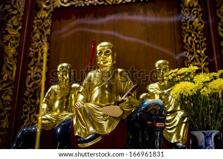 CIRCA SEPTEMBER 2011 - MY THO, VIETNAM - Buddhist statues on an altar in Vinh Trang Pagoda, on 2 September 2011, in My Tho, Mekong Delta, Vietnam