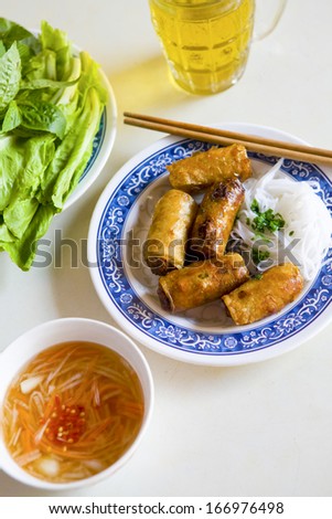 Vietnamese Cha Gio, or Spring Rolls, served with salad, dipping sauce and iced tea