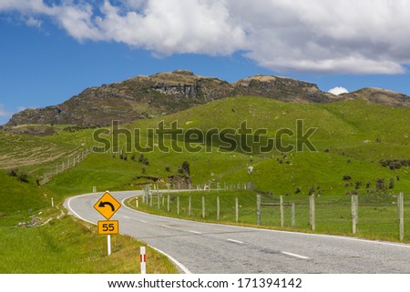Road stretching to distance in countryside near Queenstown, New Zealand