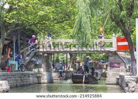 15 MAY 2014 - SHANGHAI, CHINA - Boat on canal in the old water town of Zhujiajiao, near Shanghai