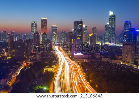 City skyline at twilight, with flyover traffic, Shanghai