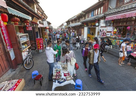 16 SEPTEMBER 2014 - DALI, CHINA - People shop in the old town of Dali, Yunnan