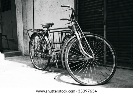 Old century bicycle used for transportation in black and white